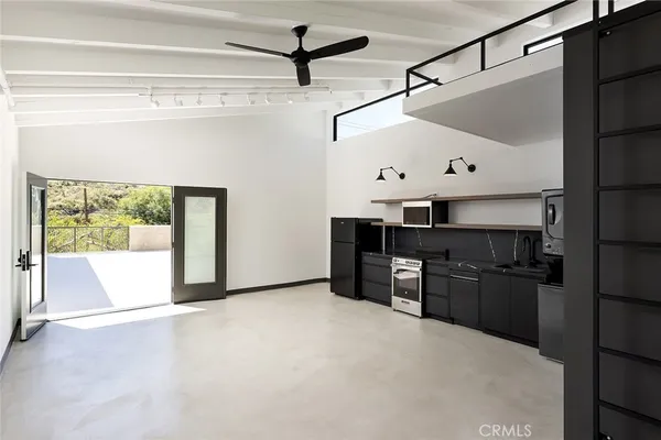 a view of kitchen with furniture and cabinets