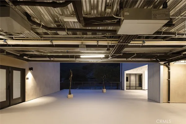 a bedroom with a bed and a television