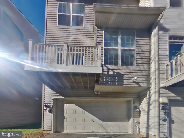 a front view of a house with garage
