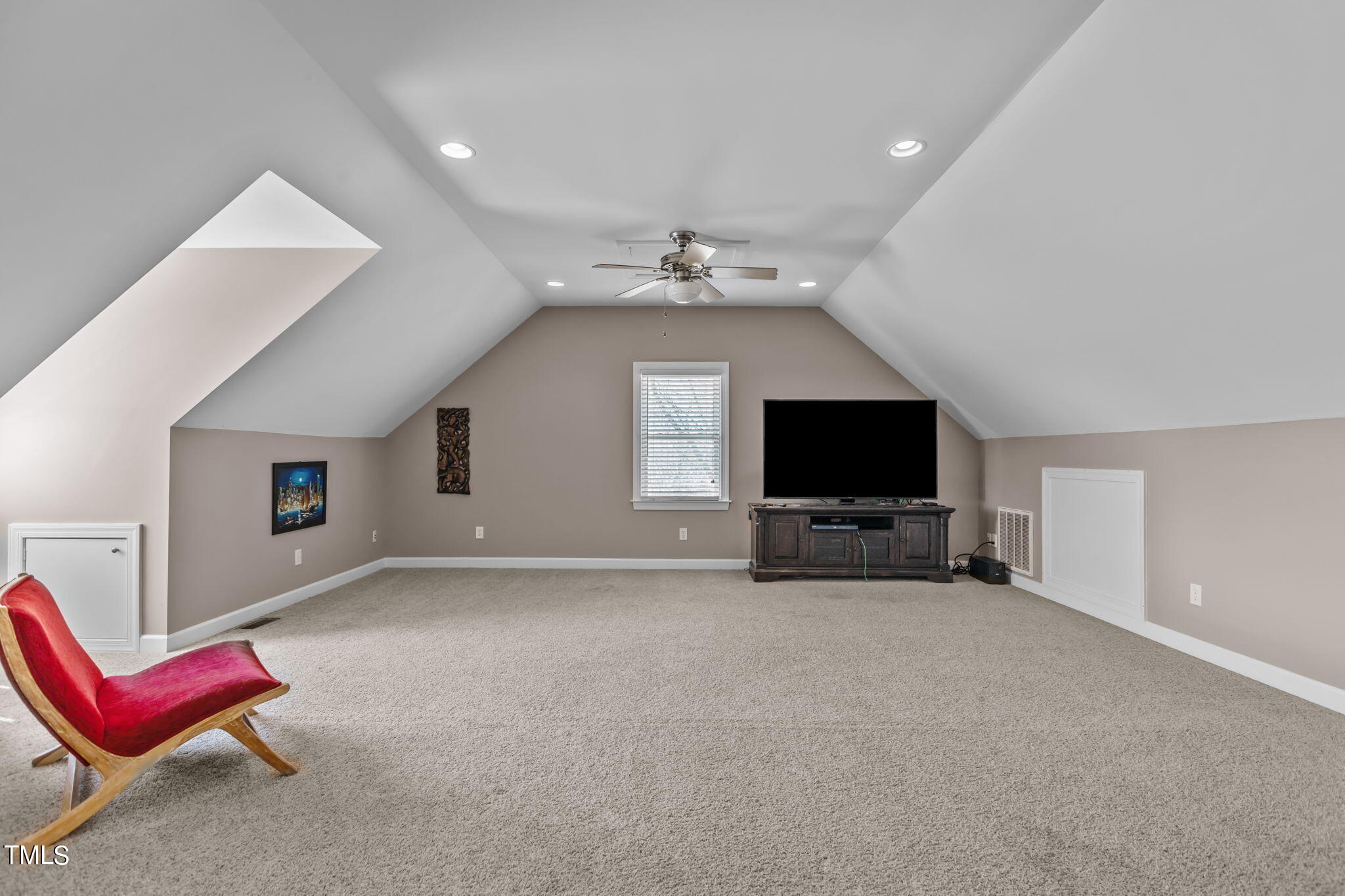 7980 Meadowbrook Road Benson, NC 27504 - Photo 48 of 56 a view of a livingroom with furniture and a flat screen tv