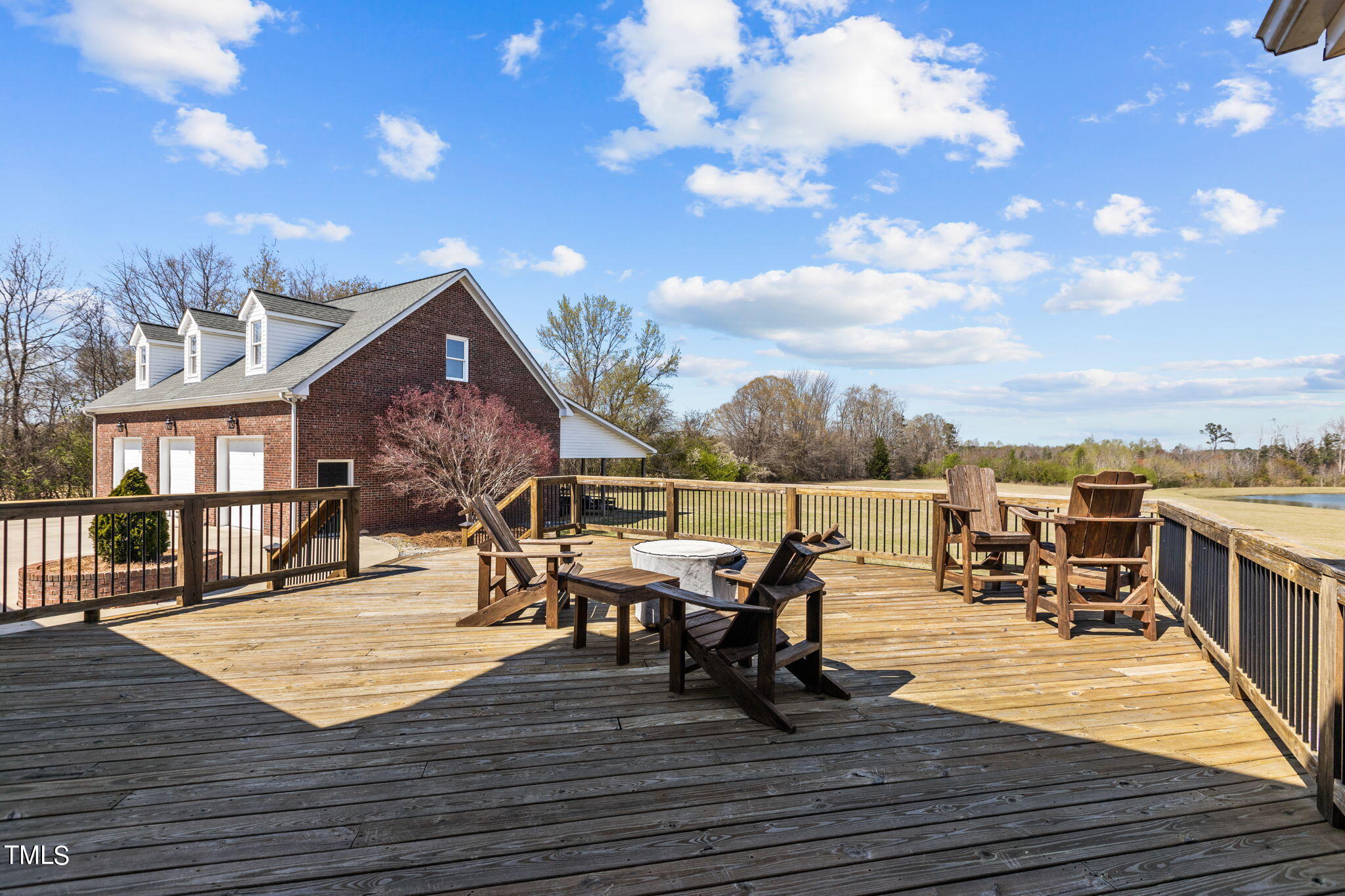 7980 Meadowbrook Road Benson, NC 27504 - Photo 54 of 56 a view of a roof deck with table and chairs
