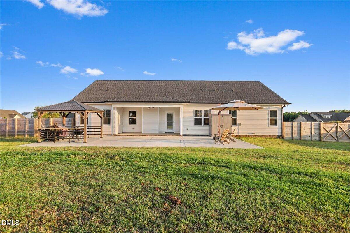 88 Heath Road Lillington, NC 27546 - Photo 26 of 54 a front view of a house with a yard