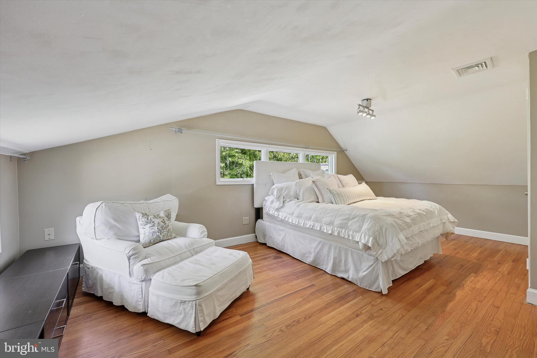 13 Devonwood Road Wayne, PA 19087 - Photo 20 of 24 a bedroom with a bed and a couch