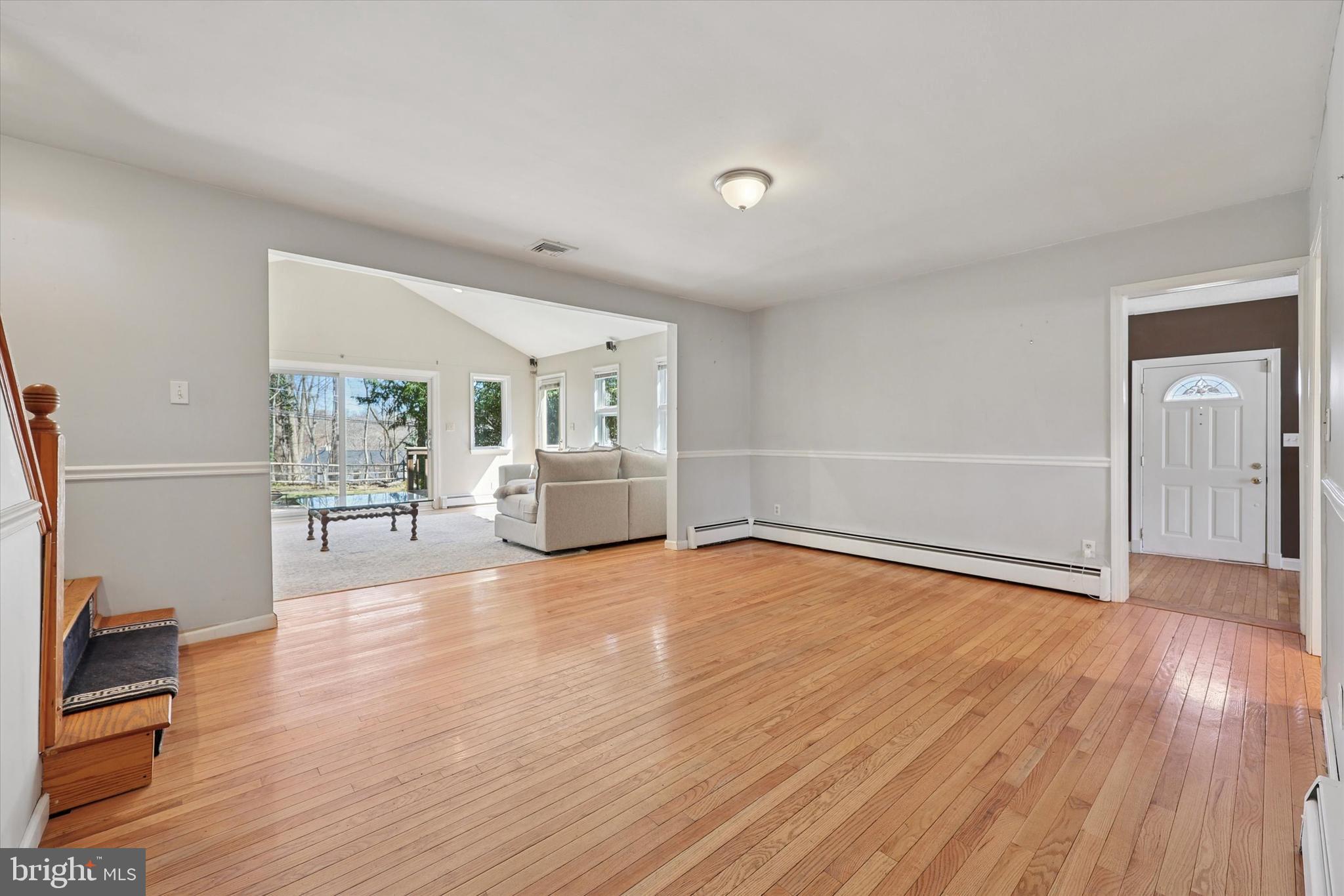 13 Devonwood Road Wayne, PA 19087 - Photo 8 of 24 a view of a livingroom with wooden floor and furniture