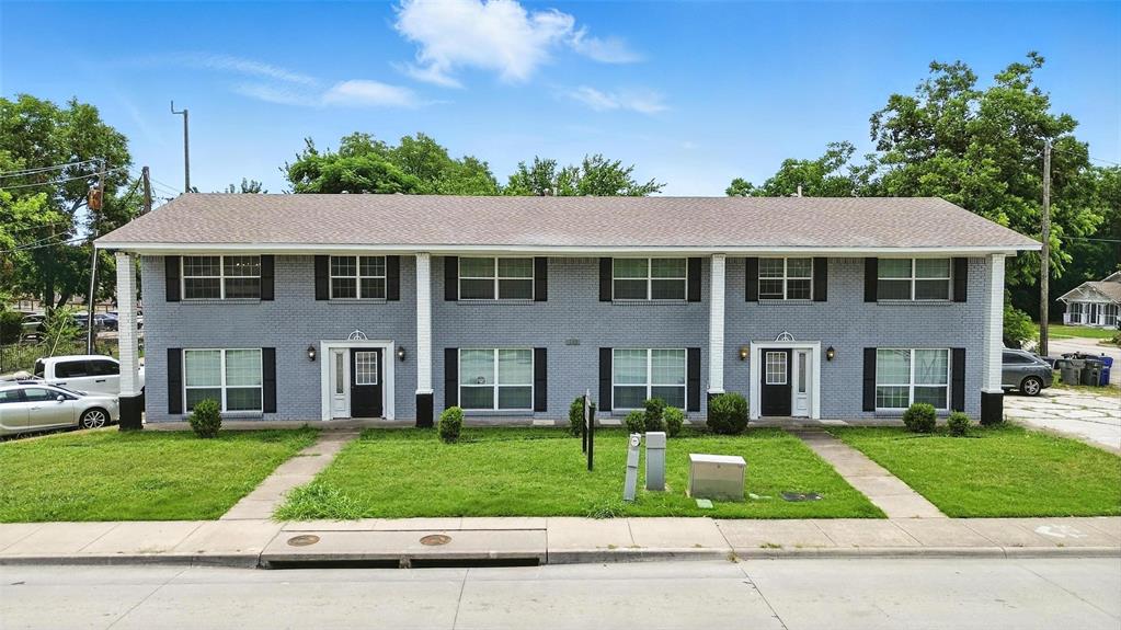103 West Brown Street, Unit 5 Wylie, TX 75098 - Photo 1 of 24 front view of a brick house with a yard