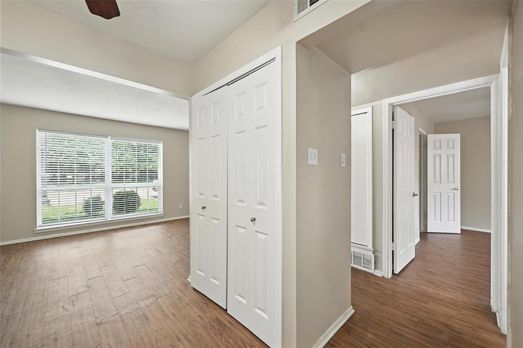103 West Brown Street, Unit 5 Wylie, TX 75098 - Photo 16 of 24 a view of a room with wooden floor and windows