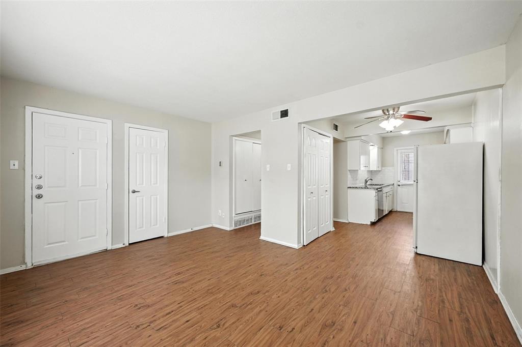 103 West Brown Street, Unit 5 Wylie, TX 75098 - Photo 2 of 24 a view of a kitchen with wooden floor and a refrigerator