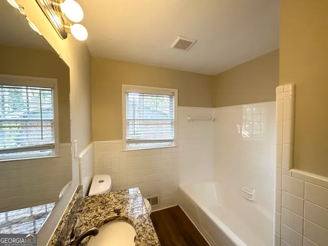 a bathroom with a sink and a shower