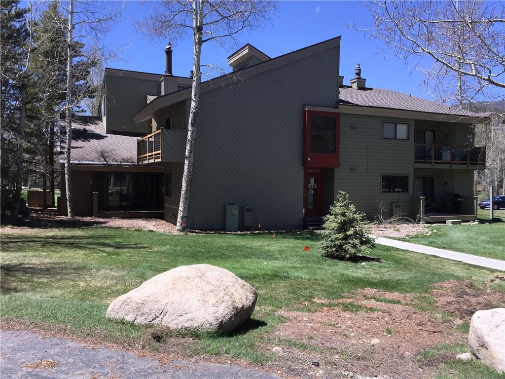 1977 Soda Ridge Road, Unit 1171 Keystone, CO 80435 - Photo 1 of 21 a view of a house with a yard and a garage