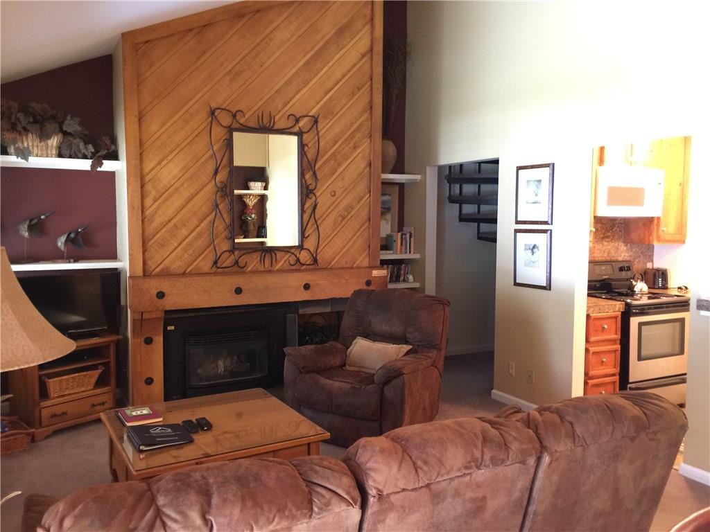 1977 Soda Ridge Road, Unit 1171 Keystone, CO 80435 - Photo 2 of 21 a living room with furniture fireplace and a window
