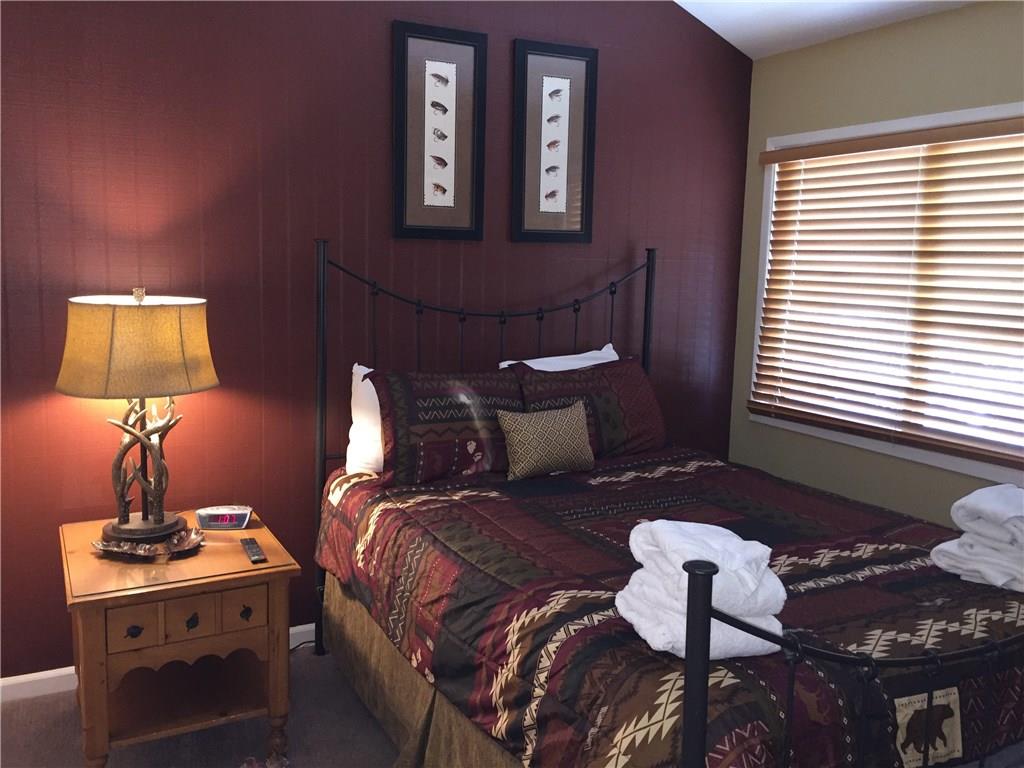 1977 Soda Ridge Road, Unit 1171 Keystone, CO 80435 - Photo 11 of 21 a bedroom with bed and a window