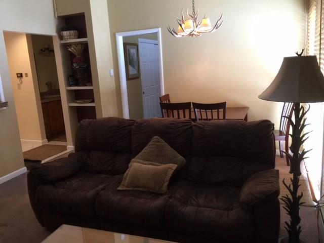 1977 Soda Ridge Road, Unit 1171 Keystone, CO 80435 - Photo 16 of 21 a living room with furniture and a lamp