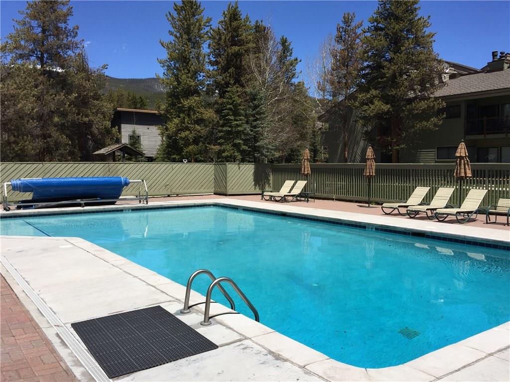 1977 Soda Ridge Road, Unit 1171 Keystone, CO 80435 - Photo 18 of 21 a view of a swimming pool with a patio and fire pit