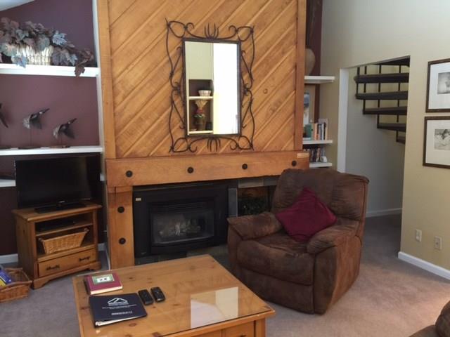 1977 Soda Ridge Road, Unit 1171 Keystone, CO 80435 - Photo 19 of 21 a living room with furniture and a fireplace