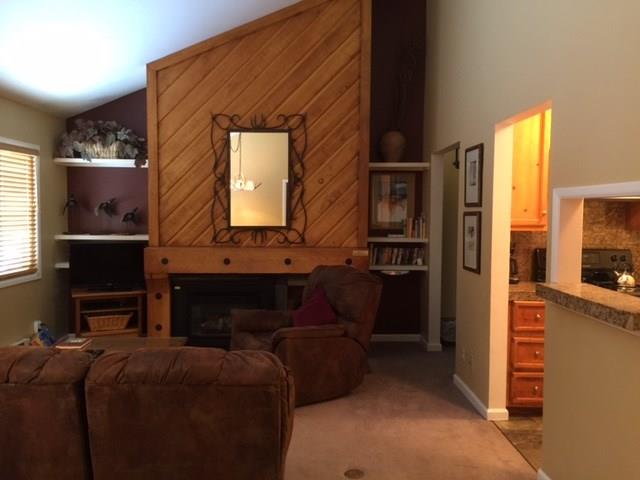 1977 Soda Ridge Road, Unit 1171 Keystone, CO 80435 - Photo 5 of 21 a living room with furniture and a fireplace