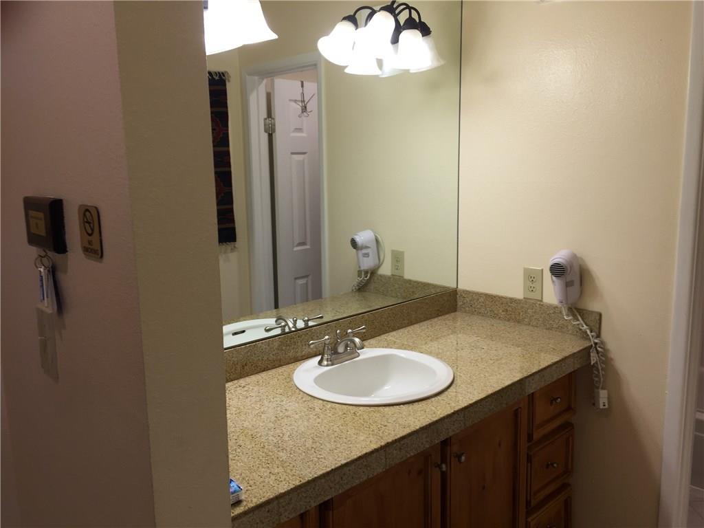 1977 Soda Ridge Road, Unit 1171 Keystone, CO 80435 - Photo 7 of 21 a bathroom with a sink and a mirror