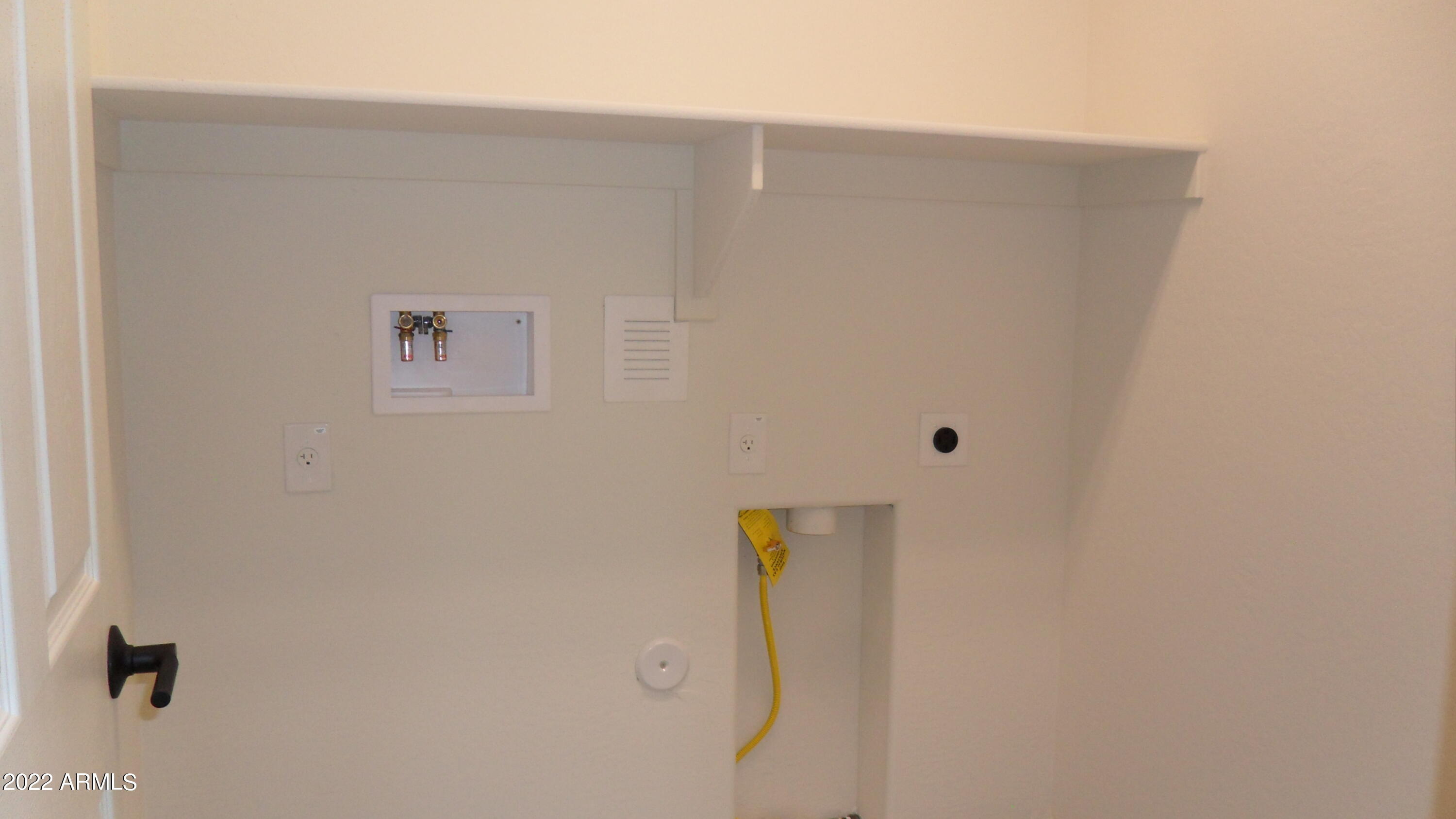 5613 North 87th Drive Glendale, AZ 85305 - Photo 8 of 16 inside lanudry w/ gas hookup