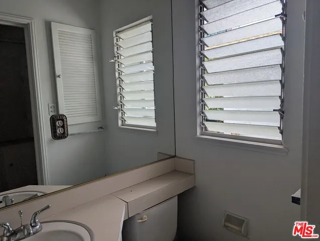 a room with a window and a chair