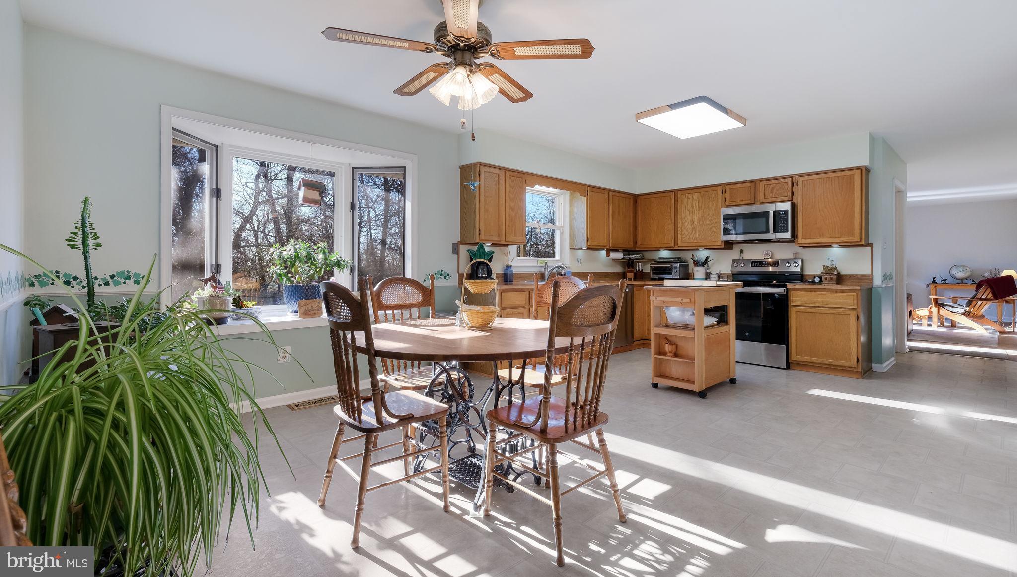 1267 Holly Road Warrington, PA 18976 - Photo 13 of 42 a view of a dining room with furniture window and outside view