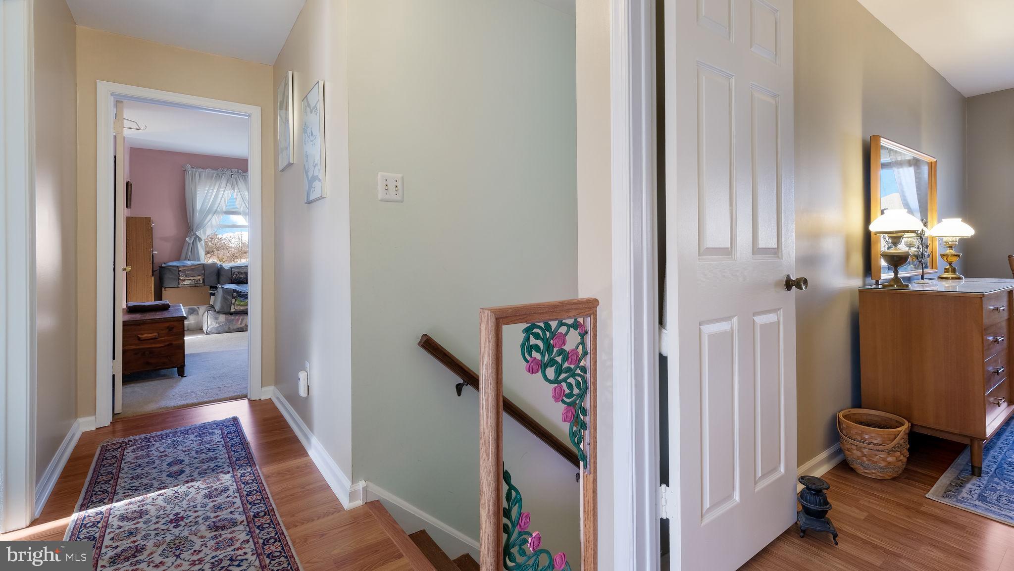 1267 Holly Road Warrington, PA 18976 - Photo 21 of 42 a view of a hallway and a livingroom with furniture