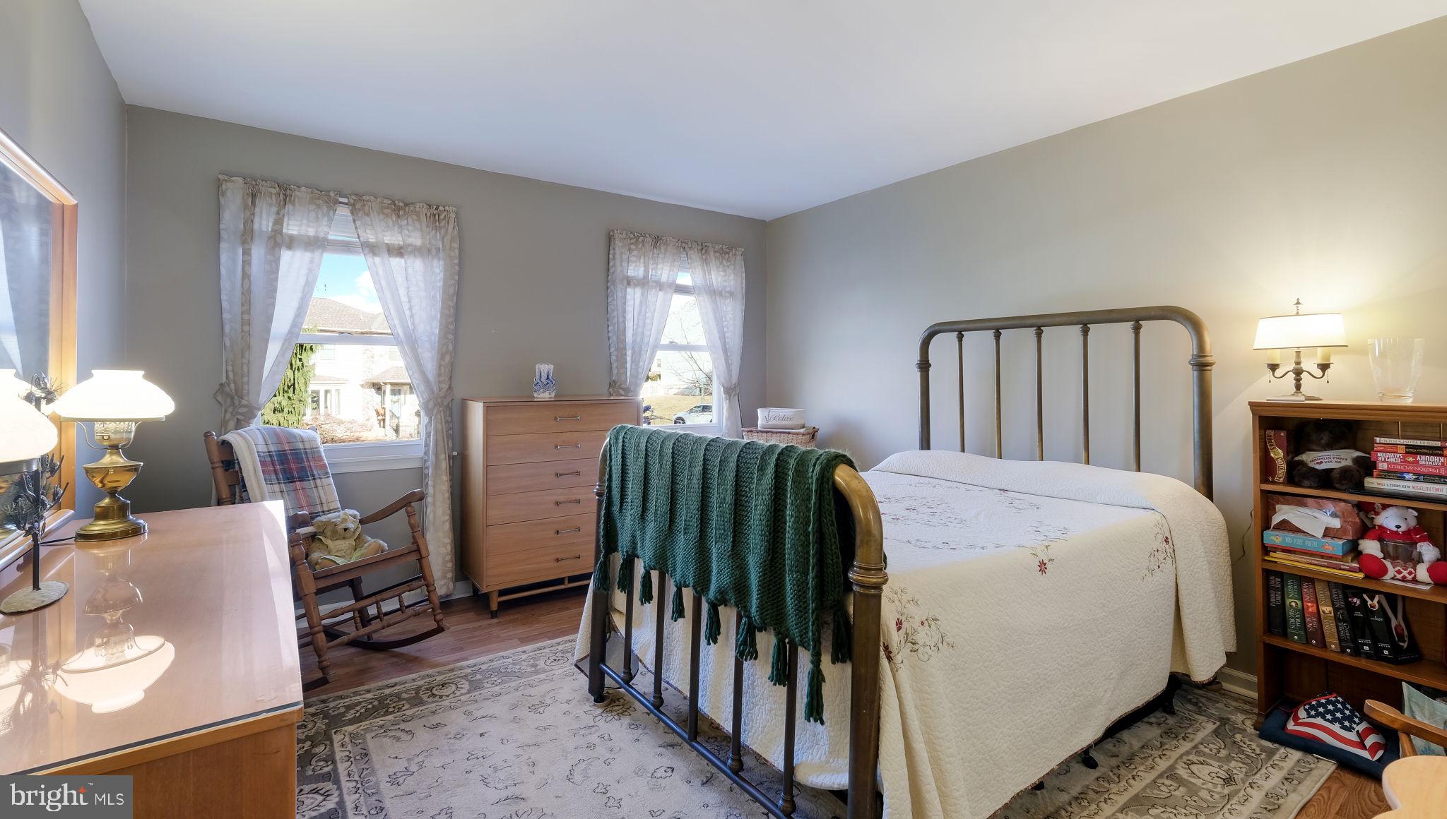 1267 Holly Road Warrington, PA 18976 - Photo 29 of 42 a bedroom with a bed and a book shelf