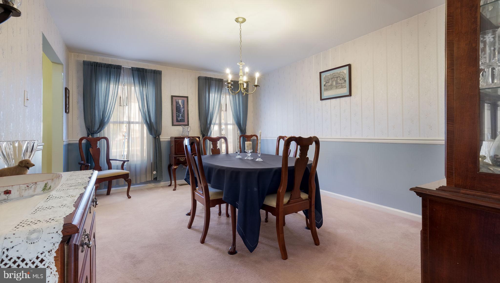 1267 Holly Road Warrington, PA 18976 - Photo 10 of 42 a view of a a dining room with furniture window and wooden floor