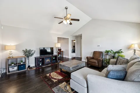 a kitchen with kitchen island a counter space a sink stainless steel appliances and cabinets