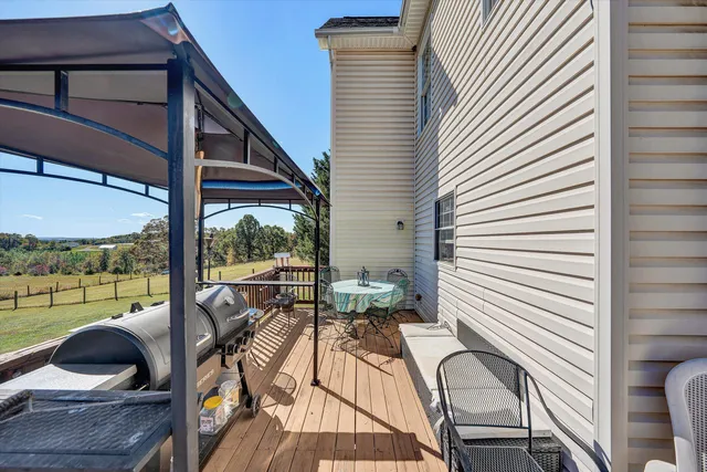 a view of a balcony with chair and a patio