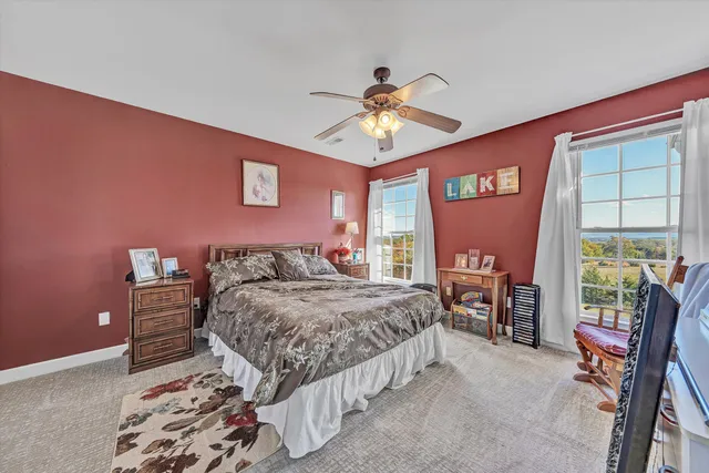 a bedroom with furniture and a baby crib