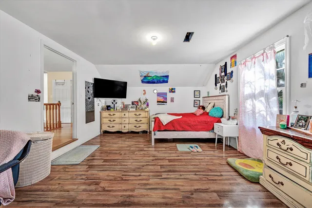a view of entryway with stairs and wooden floor
