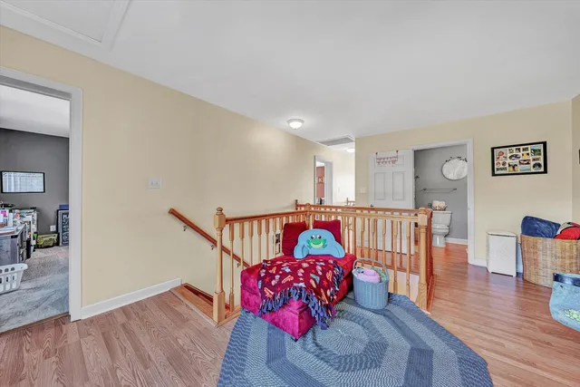 a bathroom with a sink mirror vanity and toilet