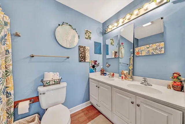 a bedroom with furniture and a flat screen tv