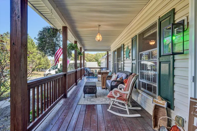 a view of a chairs and table in the balcony