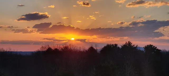 a view of city and mountain from a balcony