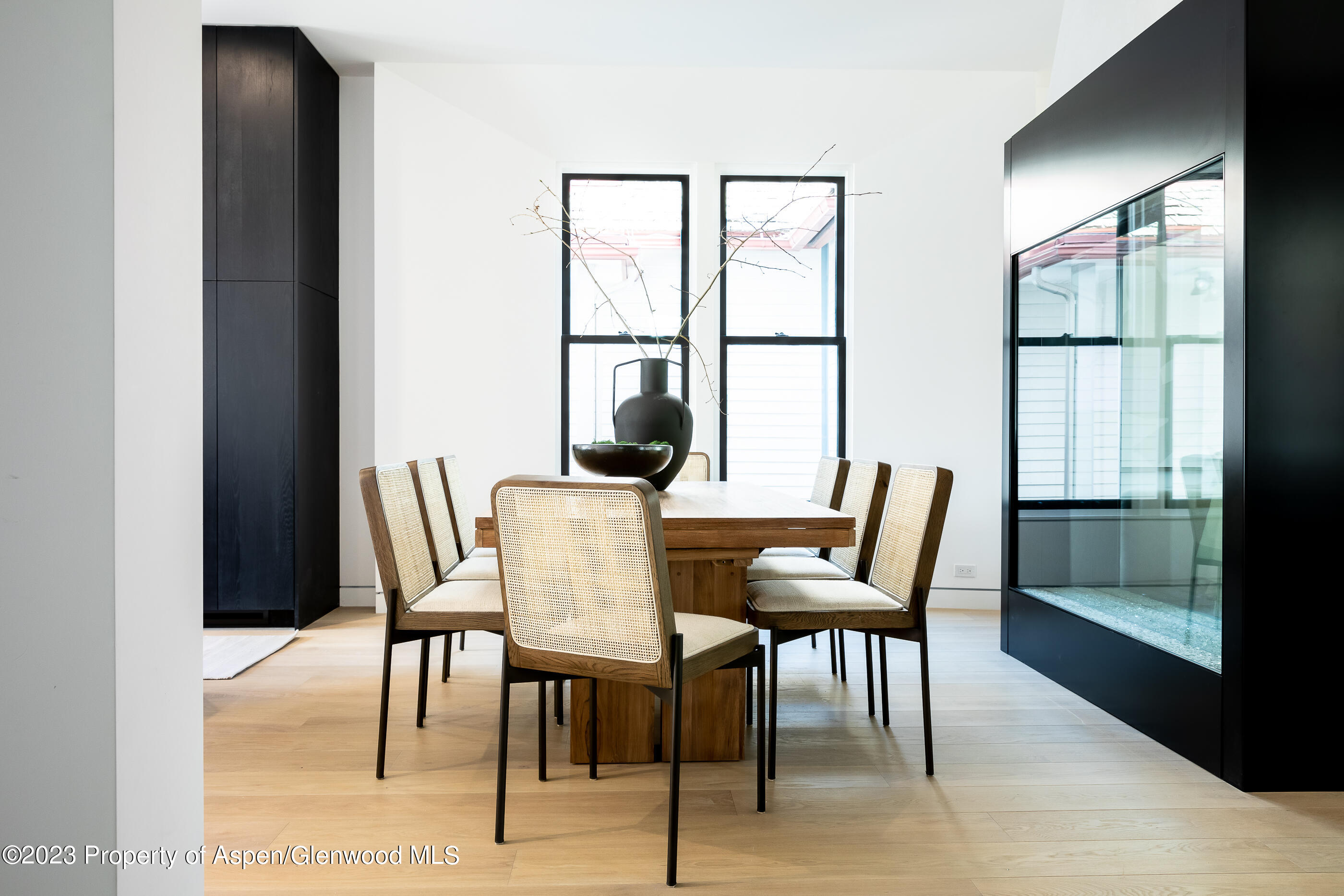 125 West Main Street Aspen, CO 81611 - Photo 14 of 52 a dining room with furniture and window