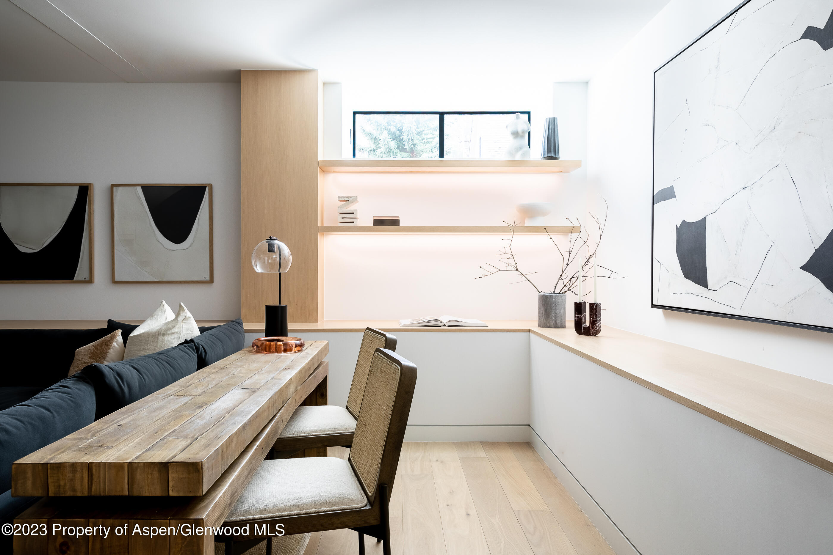 125 West Main Street Aspen, CO 81611 - Photo 19 of 52 a kitchen with a table chairs and a refrigerator