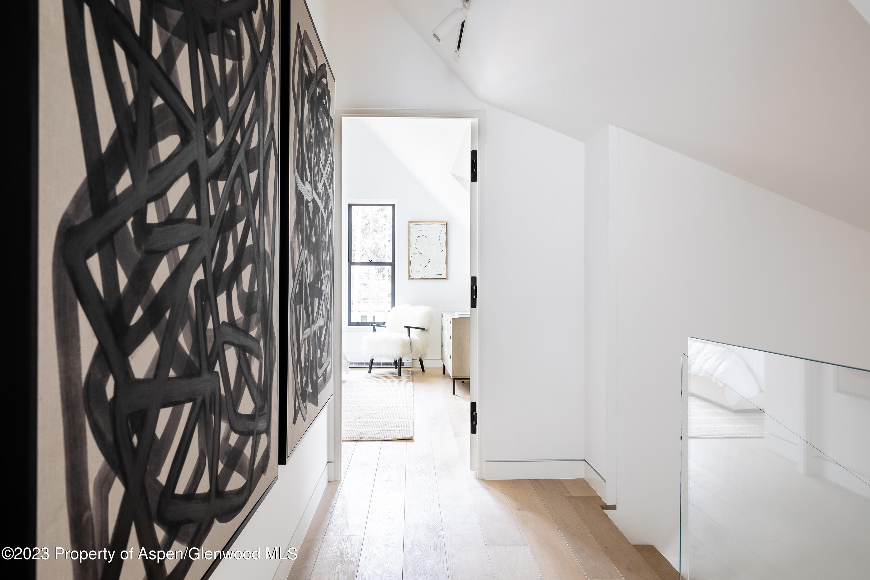 125 West Main Street Aspen, CO 81611 - Photo 22 of 52 a view of entryway with wooden floor