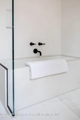 a picture of a bathroom with a shower