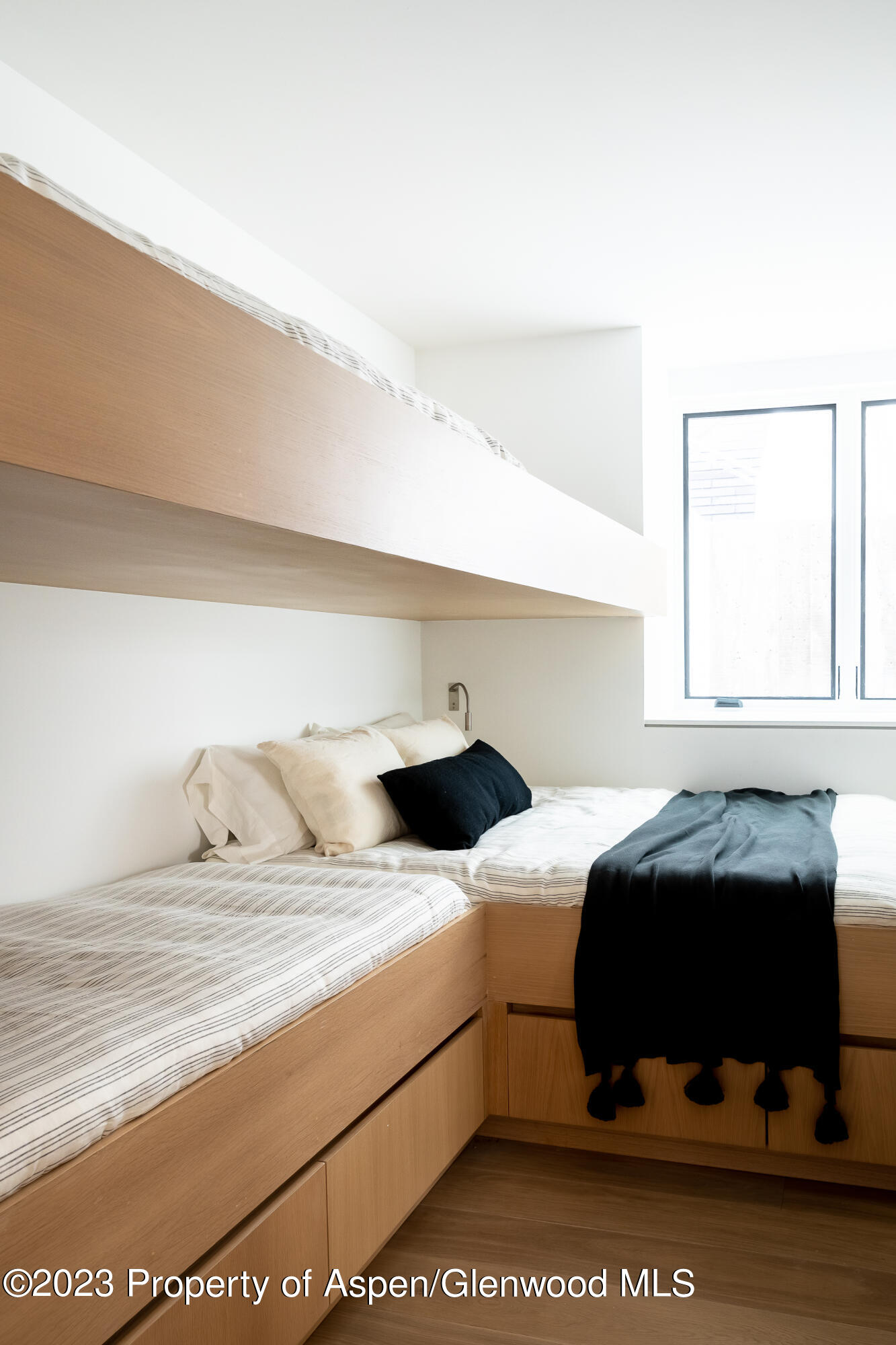 125 West Main Street Aspen, CO 81611 - Photo 40 of 52 a bedroom with a bed and window