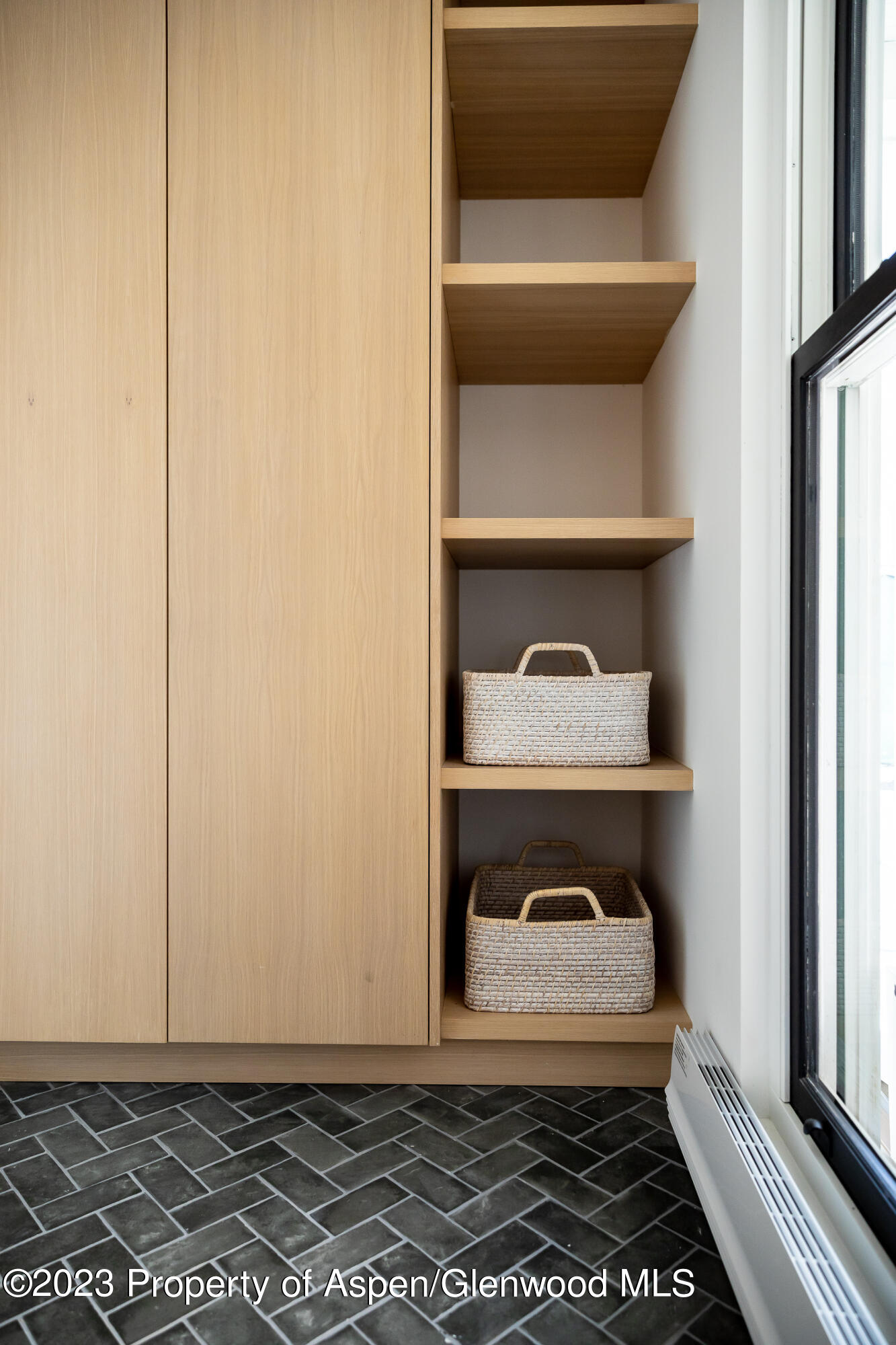 125 West Main Street Aspen, CO 81611 - Photo 49 of 52 a room that has a rug and a chair