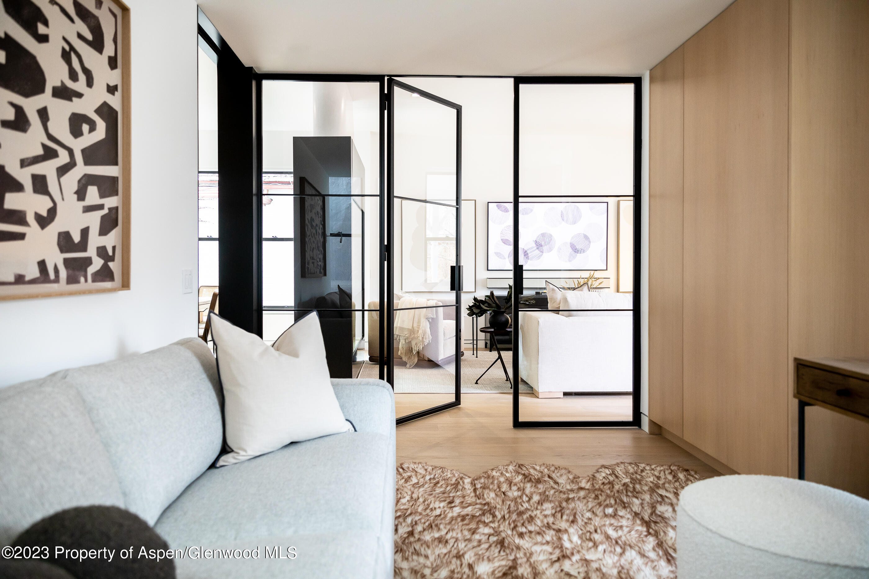 125 West Main Street Aspen, CO 81611 - Photo 7 of 52 a living room with furniture and a window