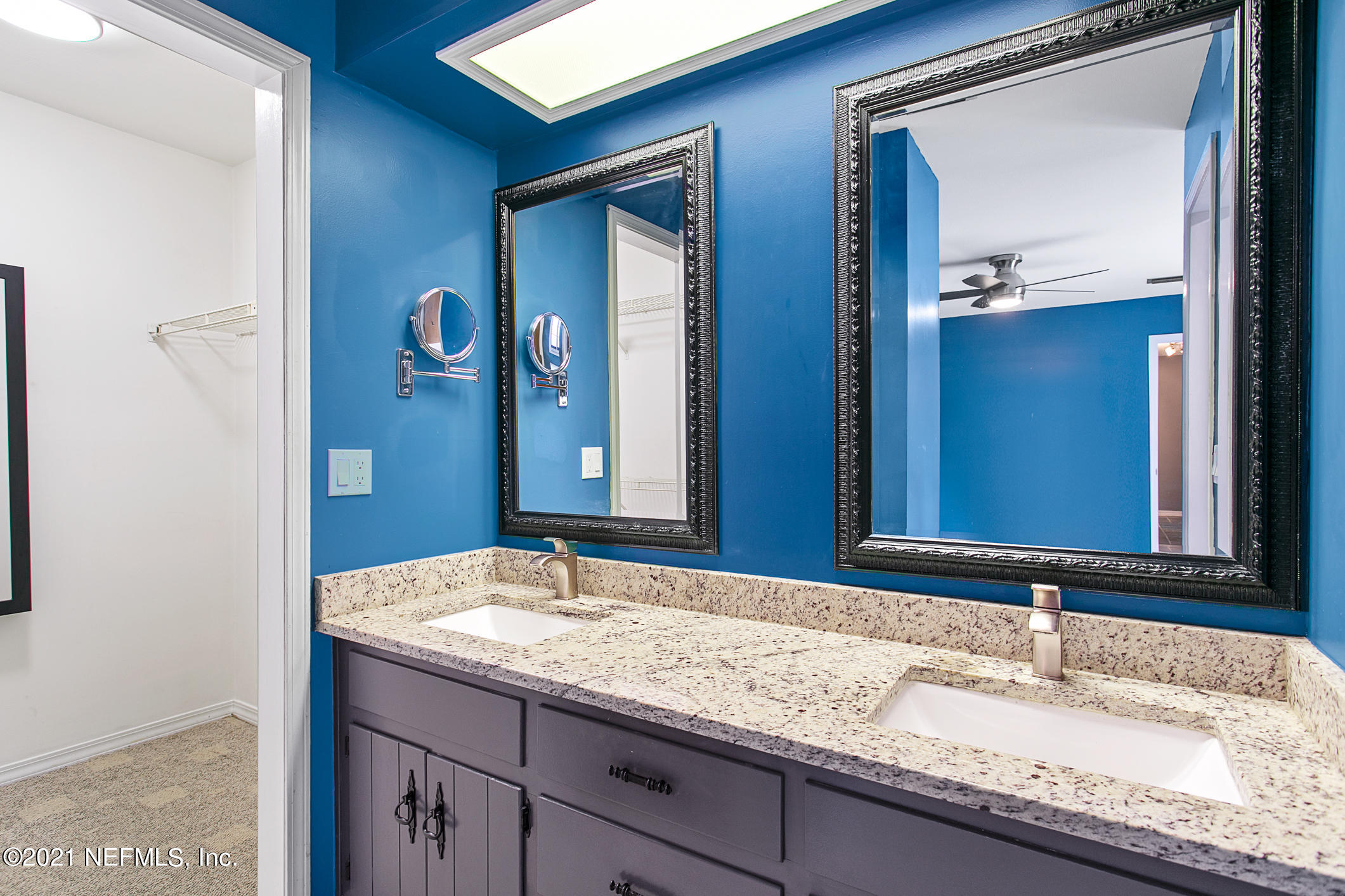 11705 Edinburgh Way Jacksonville, FL 32223 - Photo 13 of 33 a bathroom with a granite countertop sink and a mirror