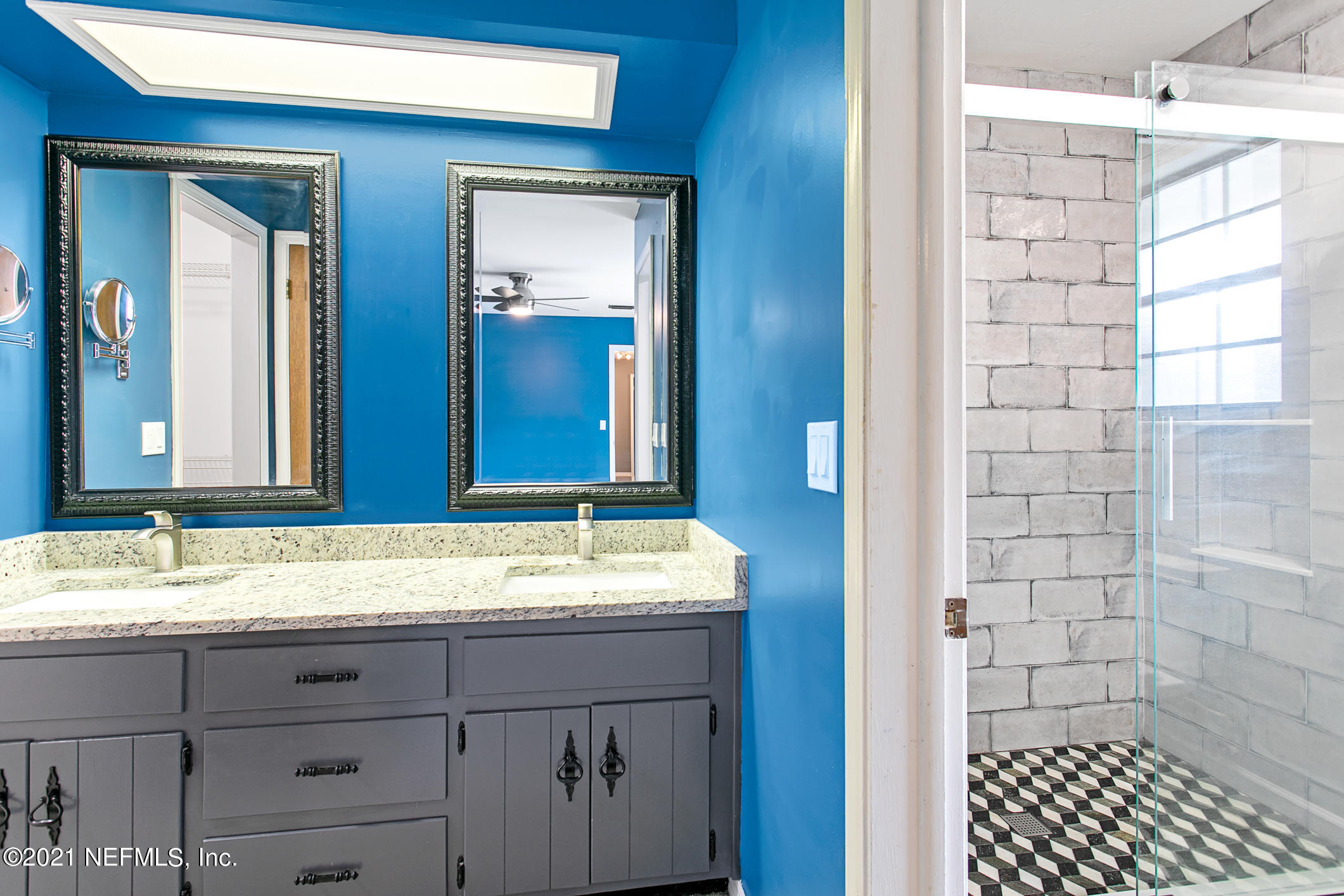 11705 Edinburgh Way Jacksonville, FL 32223 - Photo 14 of 33 a bathroom with a sink and a mirror