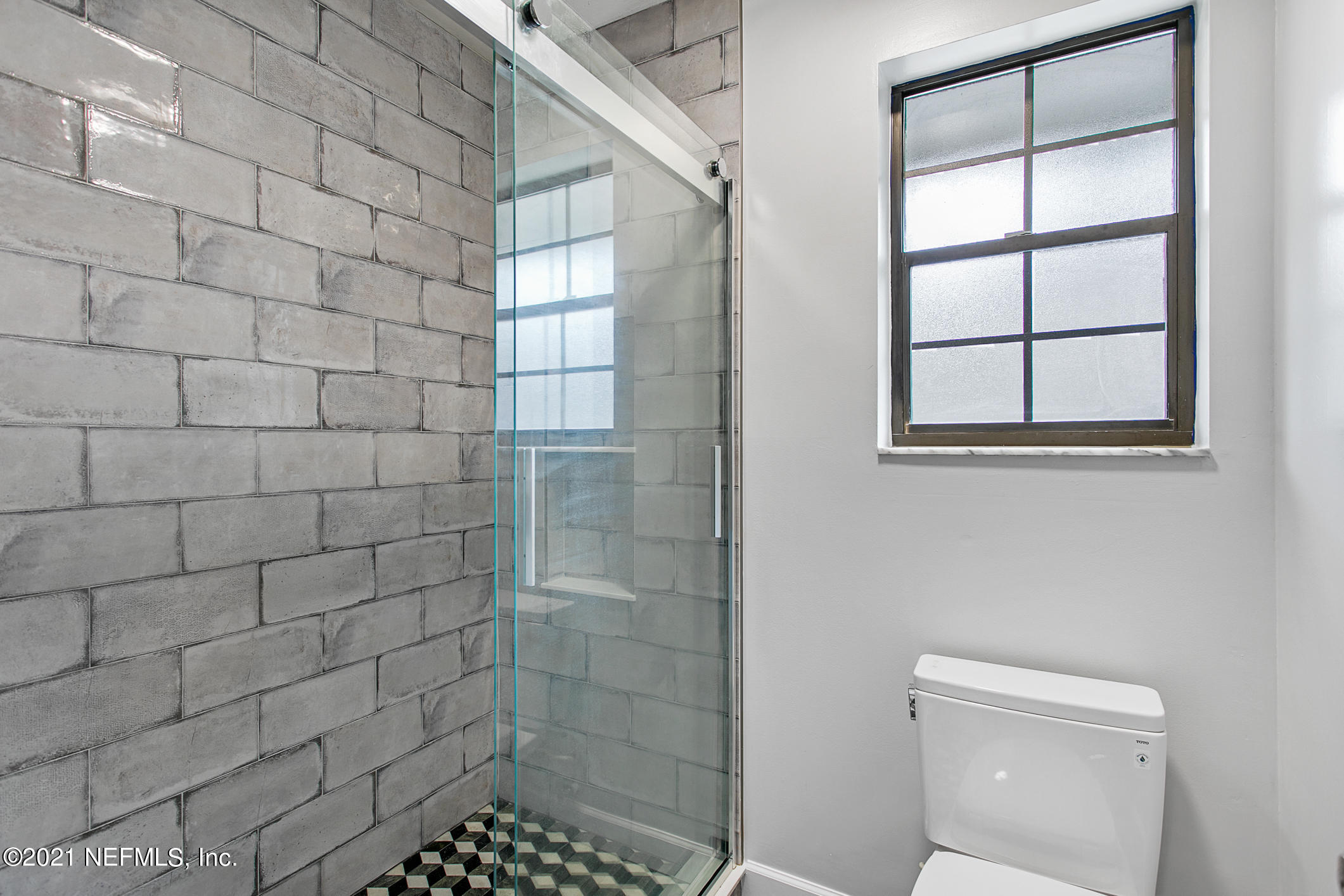 11705 Edinburgh Way Jacksonville, FL 32223 - Photo 15 of 33 a bathroom with a shower and a toilet