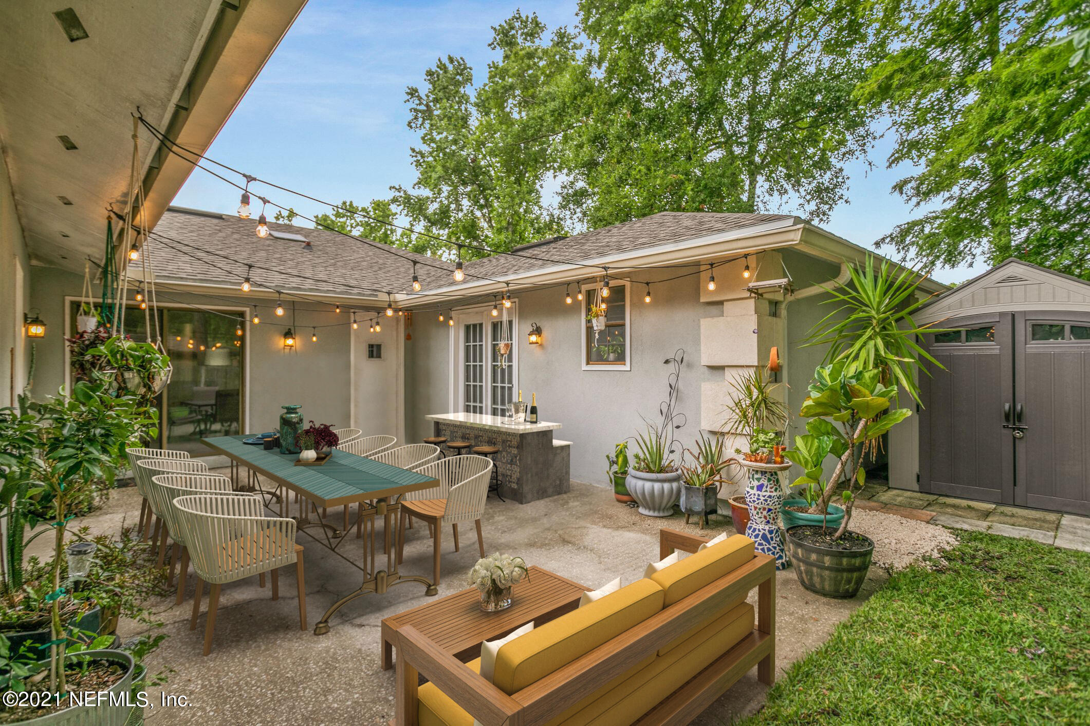 11705 Edinburgh Way Jacksonville, FL 32223 - Photo 17 of 33 a backyard of a house with outdoor seating