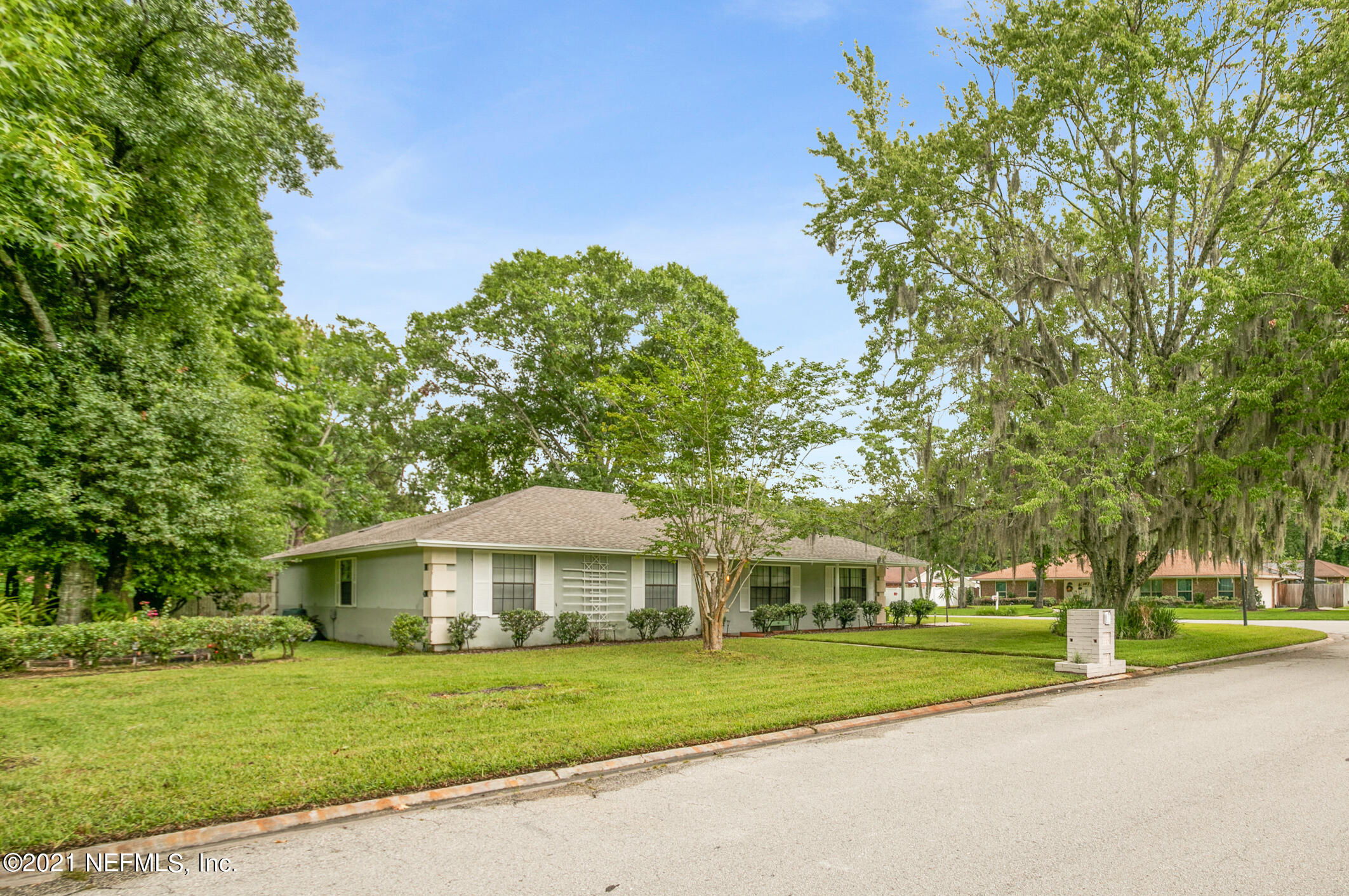 11705 Edinburgh Way Jacksonville, FL 32223 - Photo 22 of 33 a front view of a house with a yard