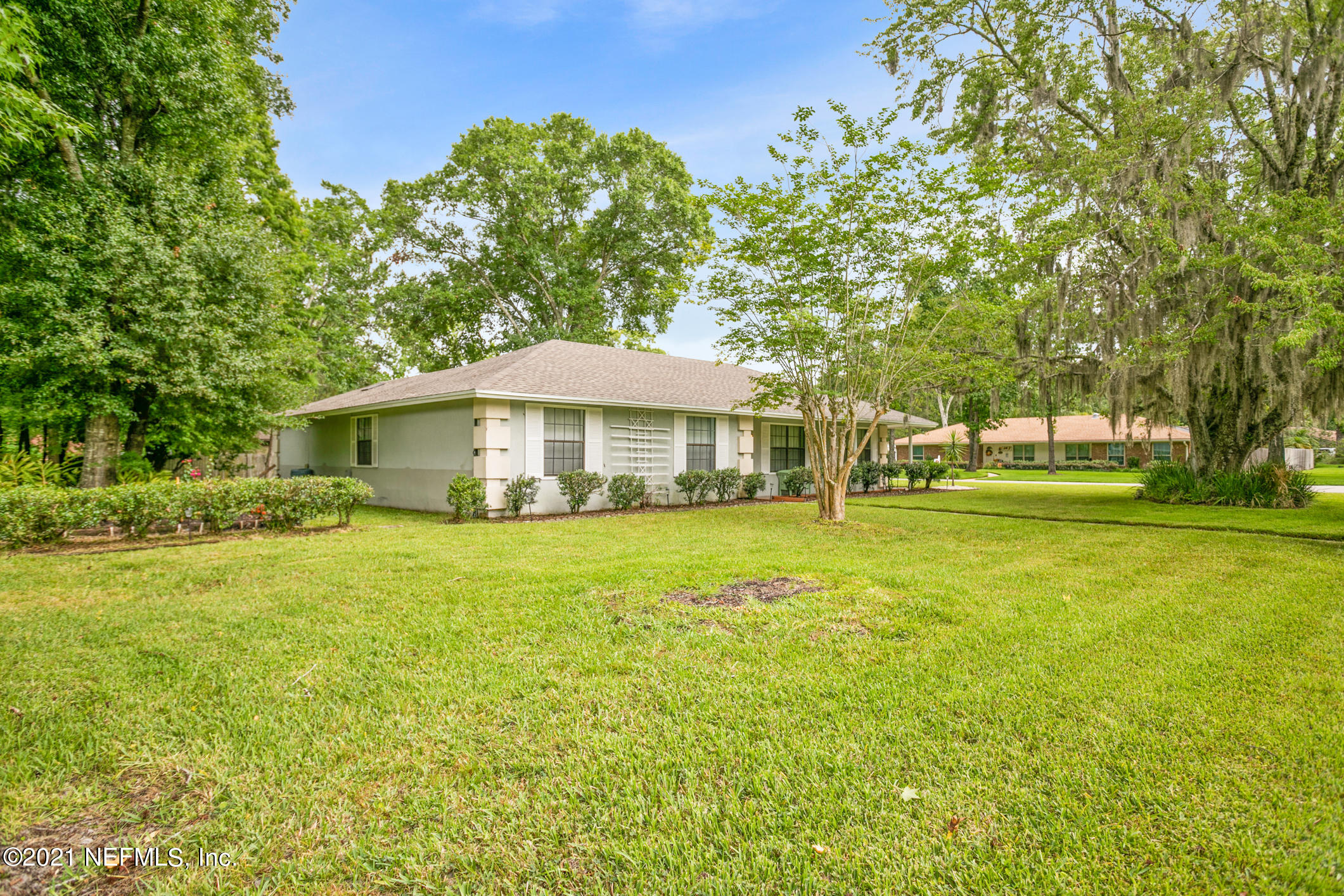 11705 Edinburgh Way Jacksonville, FL 32223 - Photo 23 of 33 a front view of a house with a yard