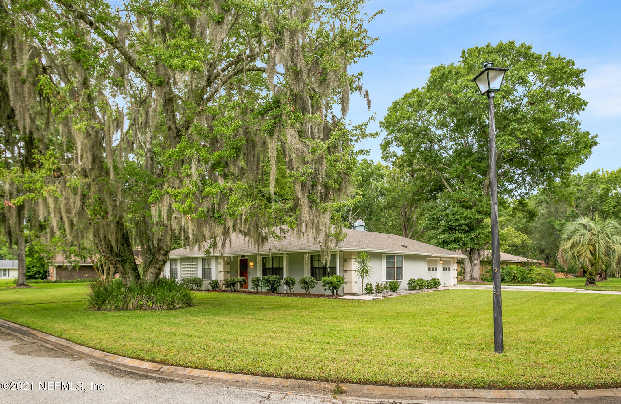 11705 Edinburgh Way Jacksonville, FL 32223 - Photo 24 of 33 a front view of a house with a garden