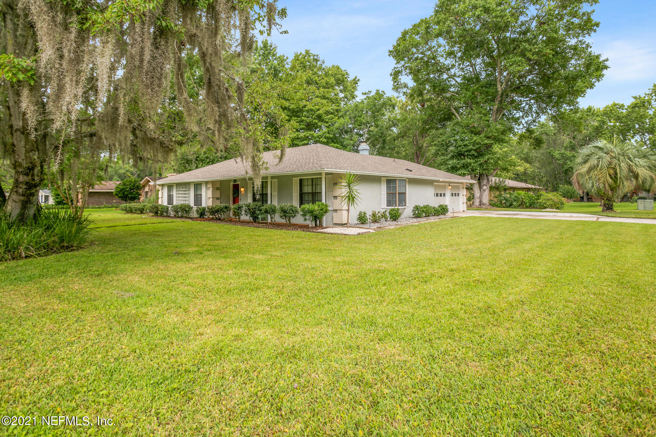 11705 Edinburgh Way Jacksonville, FL 32223 - Photo 25 of 33 a view of a house with a big yard