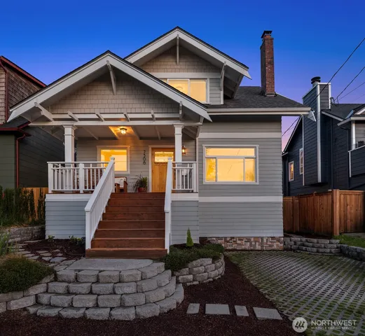 a front view of a house with wooden fence